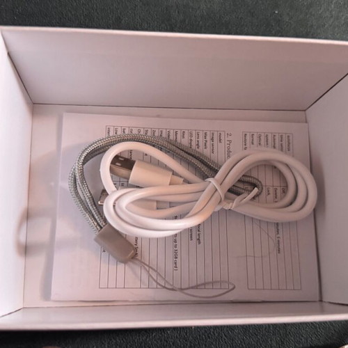 Digital camera used with velvet case, cable, battery, and strap