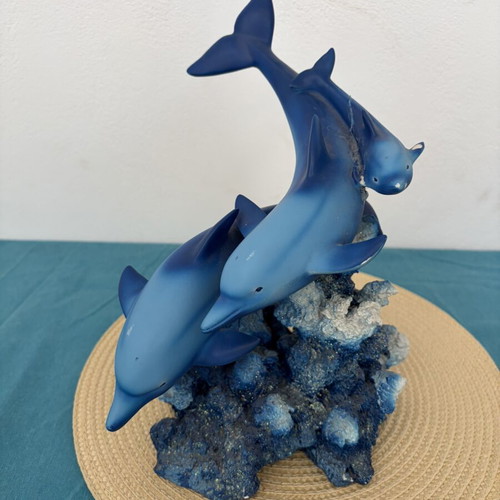 Decorative dolphins refurbished with damage