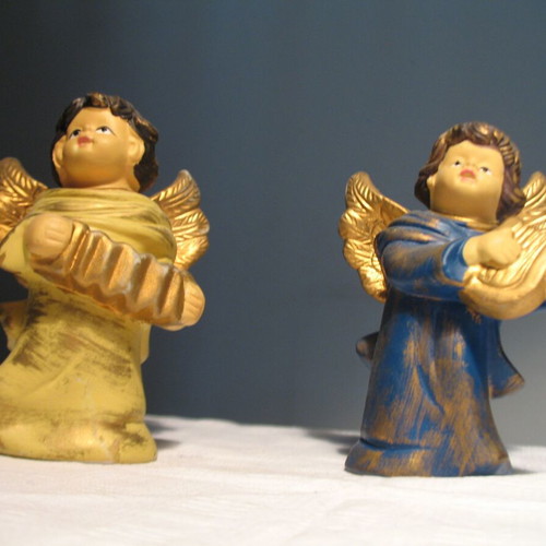 Pair of old clay angels like new