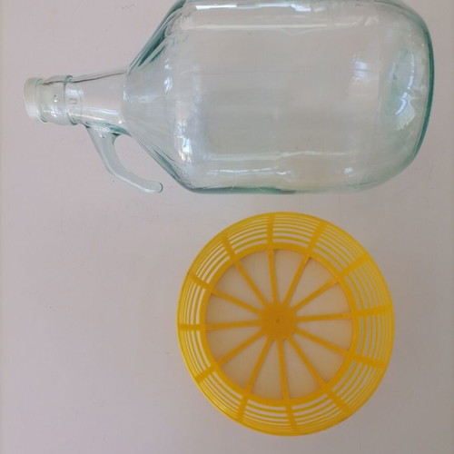 Glass 5-liter damigiana used with plastic protective base
