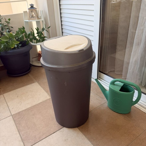 Trash bin with push button lid