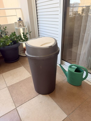 Trash bin with push button lid