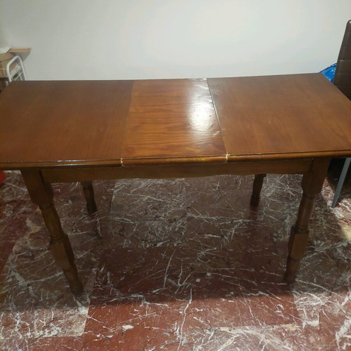 Wooden dining table with extension used