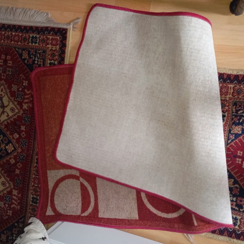 Vintage carpet runner used with geometric motifs in warm colors
