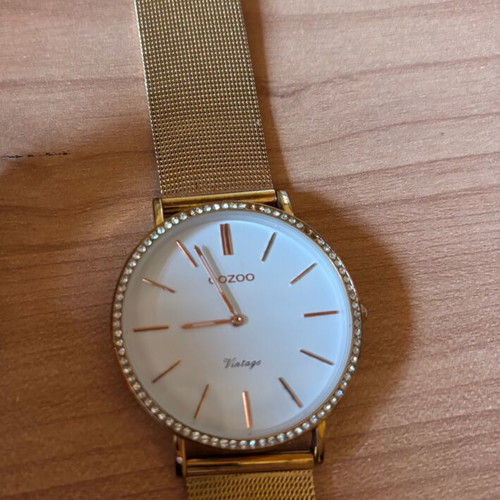 Oozoo gold watch like new, few missing rhinestones