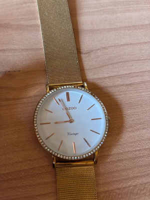 Oozoo gold watch like new, few missing rhinestones