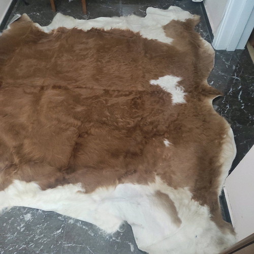 Cowhide rug like new, brown with white