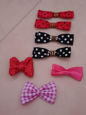 Bows like new, set of 7 multicolored