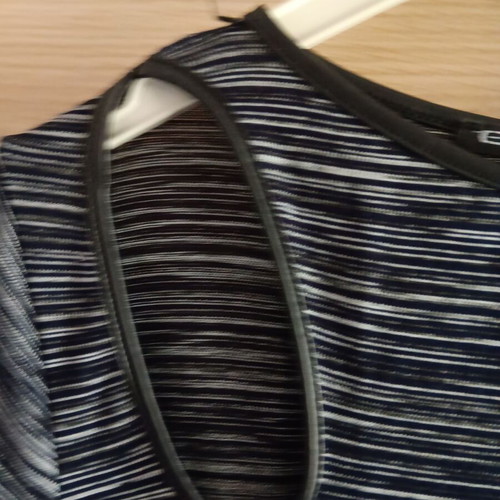 Women’s blouse like new, asymmetric with shoulder cutout, black and white