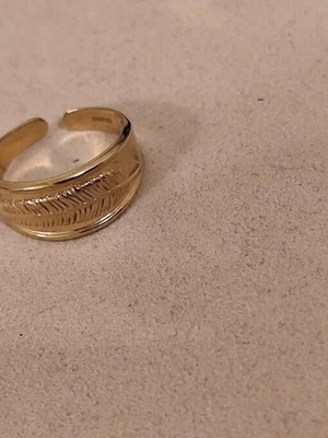 Two rings with beautiful design made of stainless steel gold color, new