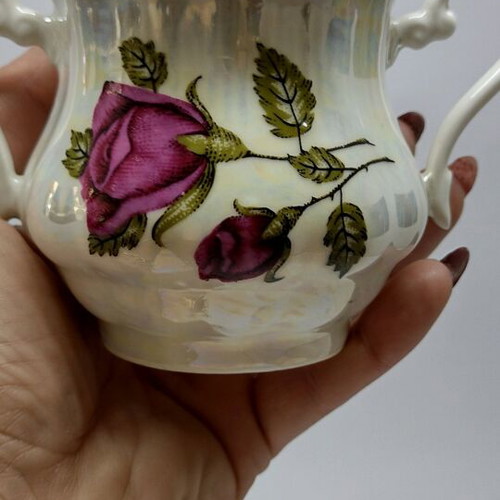 Porcelain sugar bowl with roses and gold trim like new