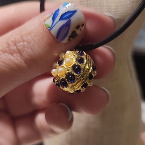 Pendant with strap and beads like new, metal gold part