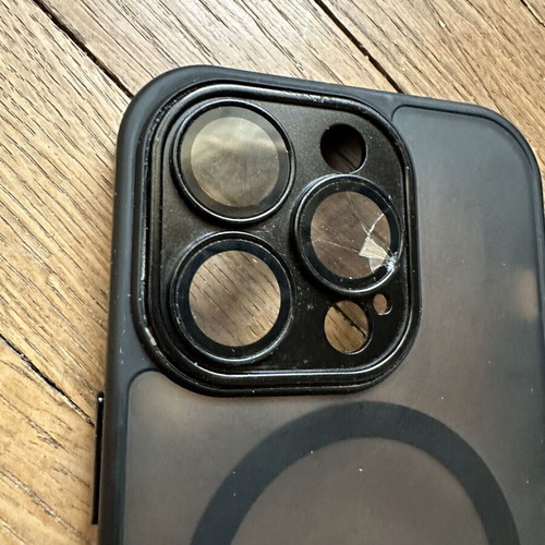 iPhone 14 Pro case with broken right lens protector