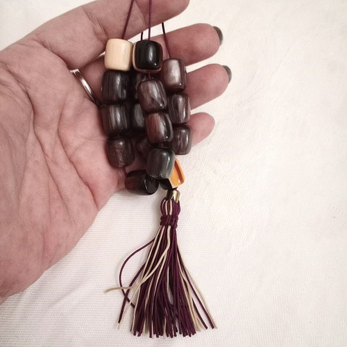 Worry beads with synthetic resin beads in purple color like new