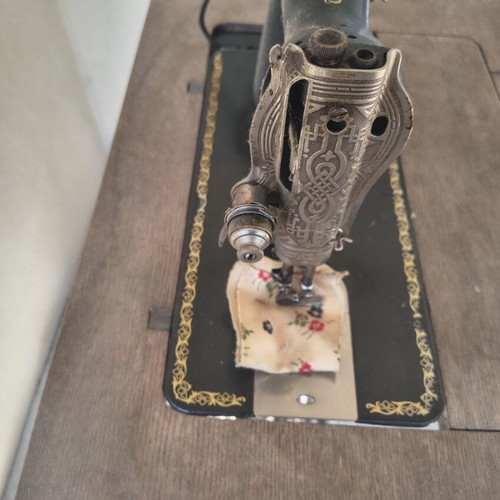 Singer vintage sewing machine used with original wooden table