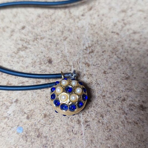 Pendant with strap and beads like new, metal gold part