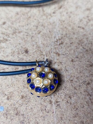 Pendant with strap and beads like new, metal gold part