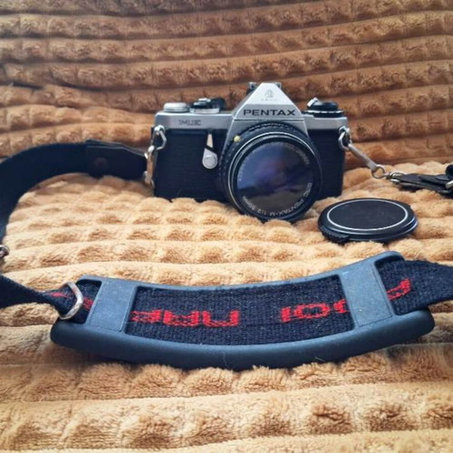 Asahi Pentax ME (1981) camera with 50mm lens and worn leather case