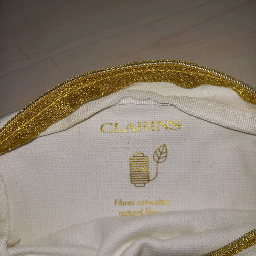 Swarovski and Clarins toiletry bags like new, set of 2 white