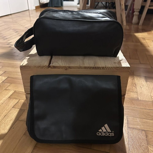 Two black leather toiletry bags, one Adidas