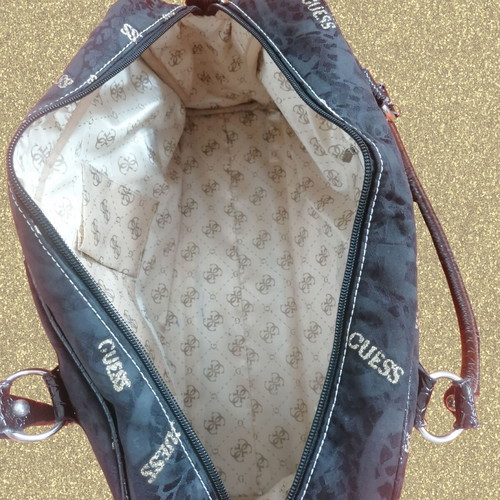 Guess vintage black handheld bag used with silver and gold details
