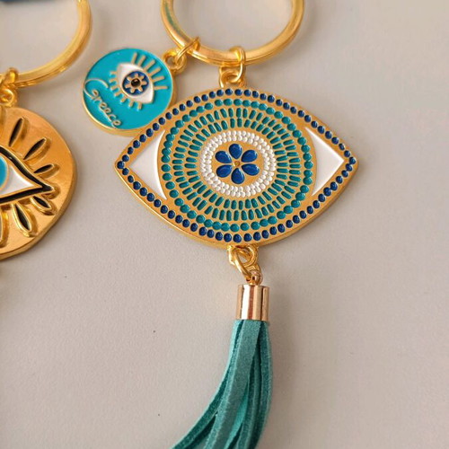 Aegeanart keychain new, gold with green tassel and evil eye