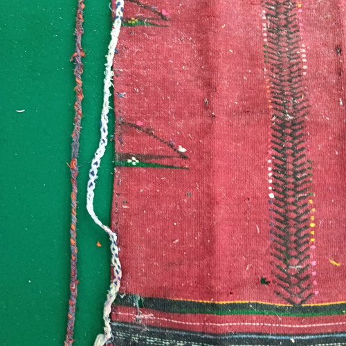 Red striped traditional costume apron used with wear