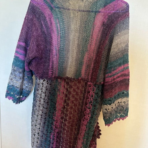 Knitted cardigan like new, multicolored with two patterns