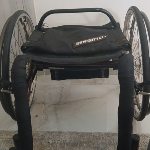 Carbon fiber folding wheelchair with quick-release wheels