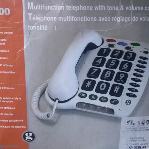 Telephone used with voice and large buttons, in its box