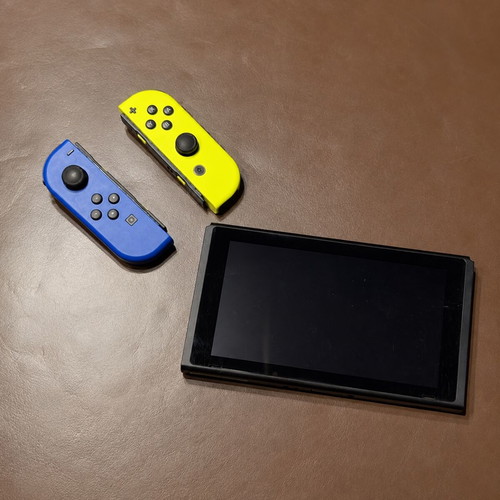 Nintendo Switch V2 console with 128GB SD card and charger