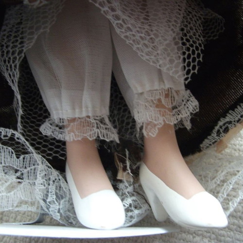 Porcelain doll used with base, box and accessories