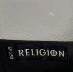 Religion dress used with asymmetrical sleeve and black stripes