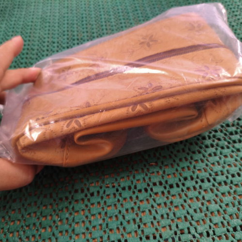 Women's cosmetic bag with floral punch-out design, synthetic leather, camel