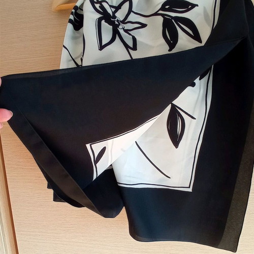 Large scarf used with floral pattern in black and white
