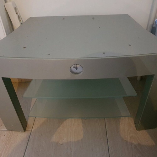 Metal TV stand with two glass shelves and built-in clock, like new