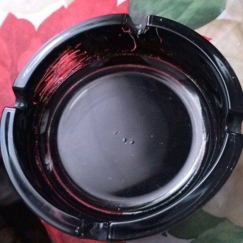 Glass ashtray vintage black classic with four cigarette slots used