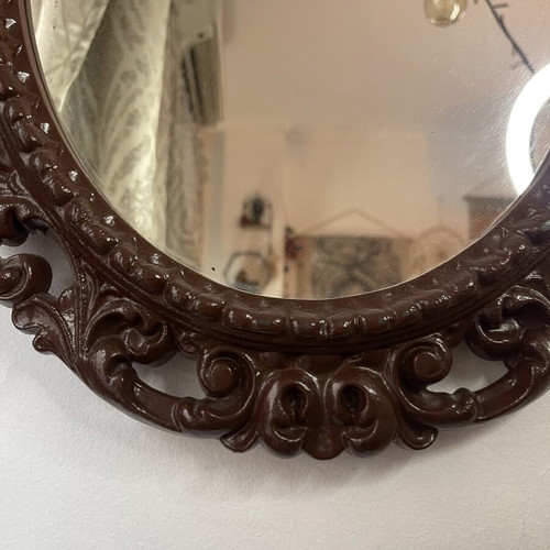 Vintage oval wall mirror with embossed frame