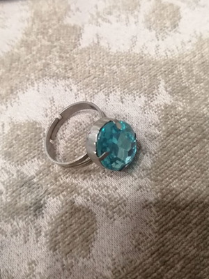 Ring with adjustable opening and blue stone like new