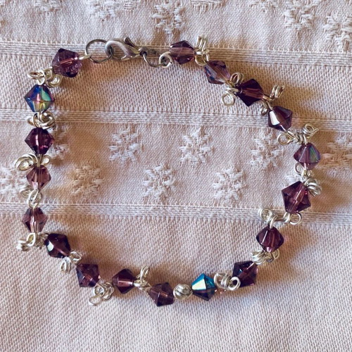Handmade bracelet with amethyst-colored crystals and silver components new