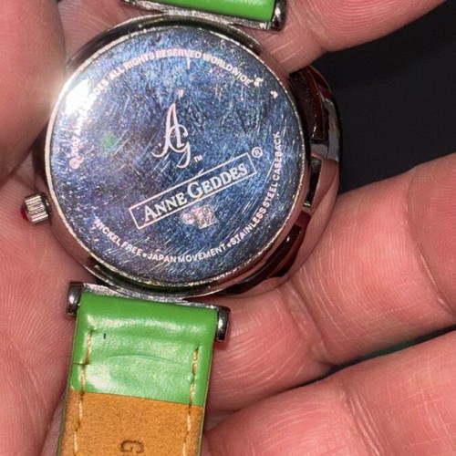 Anne Geddes wristwatch with cover and leather strap like new, colorful