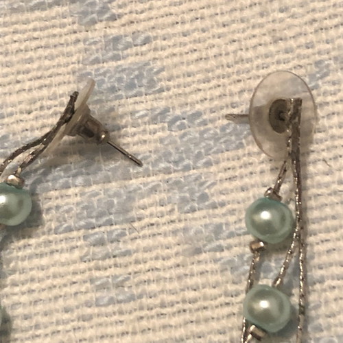 Dangling earrings with sea blue beads used
