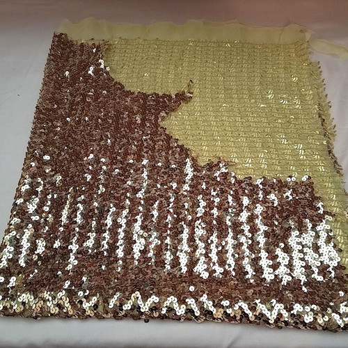 Stable fabric with gold sequins used