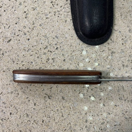 Folding knife used from 1980s with sheath