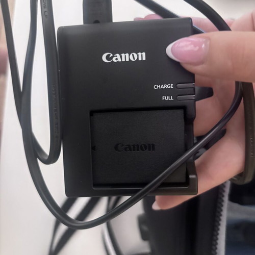 Canon EOS 2000D camera with case and tripod