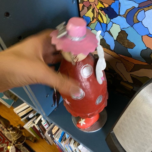 Decorative metal doll with spring like new