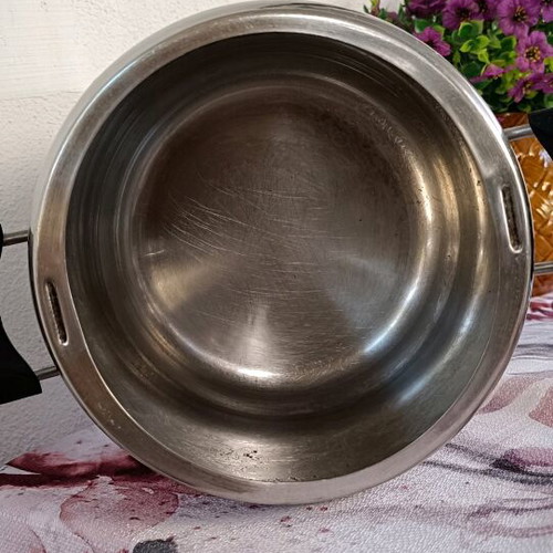 Pressure cooker used, old style, stainless steel with safety lid