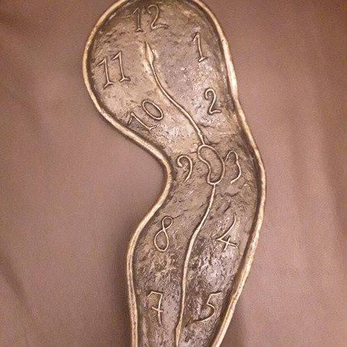 Dali wall sculpture bronze, like new, exact replica