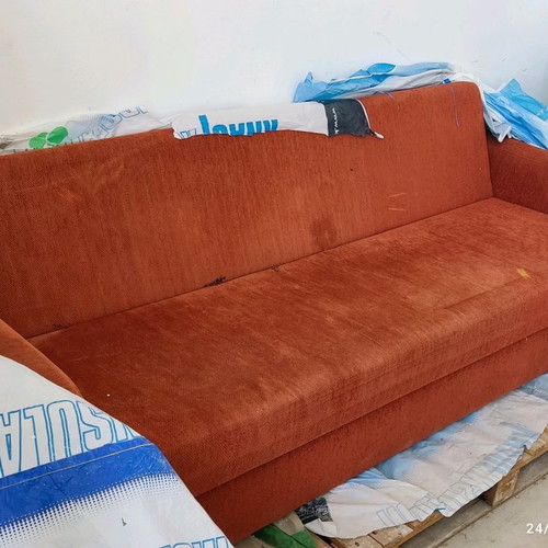 Three-seater sofa bed used with storage space
