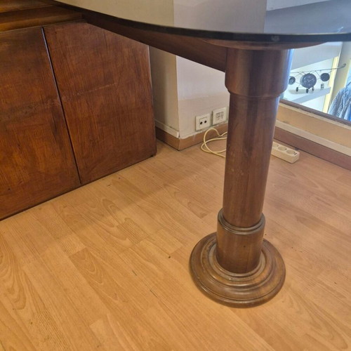 Corner desk with glass surface used, wooden base and storage